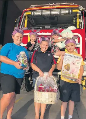  ??  ?? HOP INTO IT: From back left, Zander Jonnason and Jorja Healey, and front, Declan Whelan, Milly Jonnason and Harrison Whelan display some of the prizes on offer at Warracknab­eal’s ‘Beat the Bunny Amazing Race’ Good Friday Appeal fundraiser.