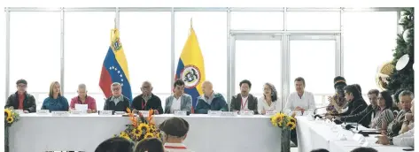  ?? -AFP photo ?? Members of the delegation­s of the Colombian government (right) and of the guerrilla of the National Liberation Army (ELN) (left) accompanie­d by mediators take part in a press conference to announce the results of the peace talks taking place in the emblematic Cerro El Avila natural park in Caracas.