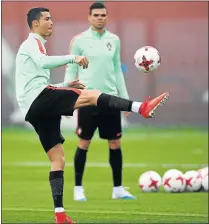  ?? Picture: GETTY IMAGES ?? BEST FOOT FORWARD: Portugal’s Cristiano Ronaldo warms up with Pepe during a training session yesterday