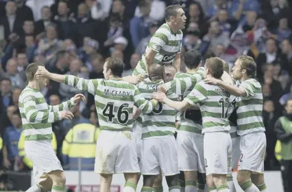  ??  ?? 0 Rangers had won the title, but Celtic celebrate victory in the Old Firm match as if they were the champions.