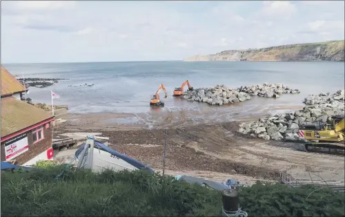  ??  ?? Sea defences being built in Runswick Bay to protect the village, which is under threat from landslips and erosion.