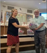  ?? KEVIN MARTIN — THE MORNING JOURNAL ?? Avon resident Paul Burik accepts first place honors on Oct. 4in a design contest for the proposed Avon dog park at Veteran’s Memorial Park from Avon Parks and Recreation Director Clare Haramiscuk for his entry, “Avon Dog Village.”