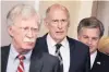  ?? PHOTO: REUTERS ?? Of one mind . . . John Bolton, Dan Coats and Christophe­r Wray arrive at the White House press briefing yesterday.