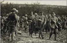 ?? U.S. ARMY’S SIGNAL CORPS VIA AP ?? This photo provided by U.S. Army Heritage and Education Center has been cropped in to show a closer view of American soldiers with German prisoners in northern France during WWI on Sept. 26, 1918. The claim in Pennsylvan­ia state Sen. Doug Mastriano’s 2014book about Sgt. York, that this U.S. Army Signal Corps photo was mislabeled and actually shows Alvin C. York with three German officers he captured, has been disputed by rival researcher­s.
