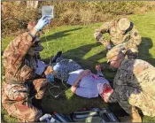  ?? PHOTOS BY ANDREW SELSKY / ASSOCIATED PRESS ?? Medics from both armies team up to practice first aid during the exercise. U.S. and Chinese forces have not collaborat­ed yet in an actual disaster response.