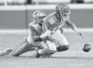  ?? Tammy Ljungblad / Kansas City Star ?? Cowboys rookie linebacker Micah Parsons strip-sacks the Chiefs’ Patrick Mahomes during the second quarter Sunday. Dallas failed to capitalize on the turnover despite a short field.