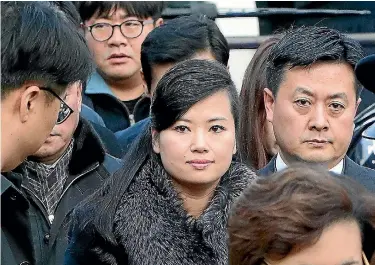  ?? PHOTO: GETTY IMAGES ?? Hyon Song Wol, head of the North Korea’s Samjiyon Orchestra, and other delegates arrive at the Seoul Train Station yesterday in South Korea.