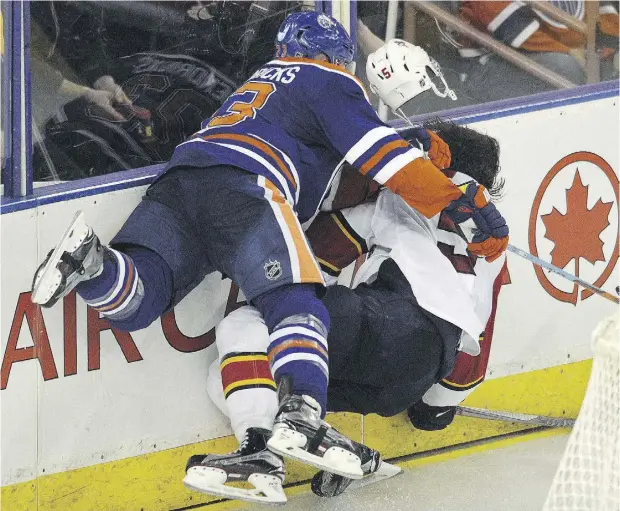  ?? DAN RIEDLHUBER / POSTMEDIA NEWS ?? After a big — but clean — hit on Taylor Hall, the Oilers’ Matt Hendricks decided to exact some revenge by going after the Panthers’ Aaron Ekblad.
