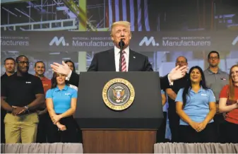  ?? Evan Vucci / Associated Press ?? President Trump addresses the National Associatio­n of Manufactur­es in Washington. He described the tax plan as a “giant, beautiful, massive, the biggest ever in our country, tax cut.”