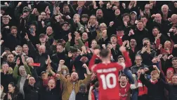  ?? GETTY IMAGES ?? Alexis Mac Allister celebrates his stunning goal in front of Liverpool fans during the 3-1 win over Sheffield United that returned Liverpool to the top of the Premier League.