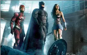  ??  ?? The Flash (Ezra Miller, from left), Batman (Ben Affleck) and Wonder Woman (Gal Gadot) star in