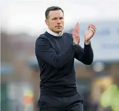  ?? ?? Interim County boss Don Cowie applauds the home fans.