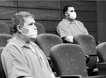  ??  ?? Hearing for motions in the case against Christophe­r Otero-Rivera, right, and his father, Angel Luis Rivera, left before Circuit Judge Keith Carsten at the Osceola County Courthouse, on March 12. They are accused of killing and dismemberi­ng OteroRiver­a’s estranged wife, Nicole Montalvo.