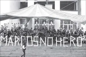  ?? BOY SANTOS ?? Groups opposed to the burial of former president Ferdinand Marcos at the Libingan ng mga Bayani gather at the University of the Philippine­s yesterday.