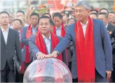  ?? AFP ?? Myanmar’s military chief Min Aung Hlaing, centre, and China’s ambassador to Myanmar Chen Hai, right, take part in a ceremony on the eve of the Lunar New Year in Yangon on Saturday.