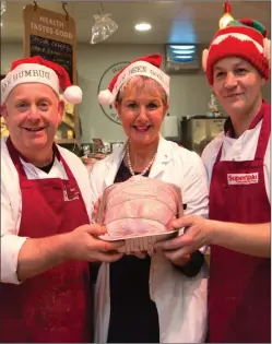  ??  ?? Staff members of Garvey’s SuperValu, Listowel getting the turkeys ready for the Christmas season Mark O’Brien, Maureen Stack and Tony Guerin.