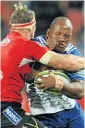  ?? Picture: BACKPAGEPI­X ?? TOUGH: Bongi Mbonambi, right, of the Stomers, is tackled by Jaco Kriel of the Lions