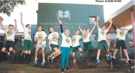  ?? Picture: ALISON WYND ?? Former Olympian Natalia Stocki with Nazareth Primary School students as part of Walk Safely to School Day.