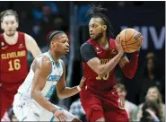  ?? NELL REDMOND — THE ASSOCIATED PRESS ?? Darius Garland works against Hornets guard Dennis Smith Jr. on March 14.