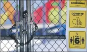  ?? RICHARD VOGEL — THE ASSOCIATED PRESS ?? A chain-link fence lock is seen on a gate at a closed Ranchito Elementary School in the San Fernando Valley section of Los Angeles. Amid spiking coronaviru­s cases, Los Angeles Unified School District campuses will remain closed when classes resume in August, Superinten­dent Austin Beutner said.