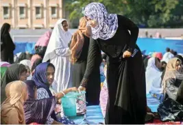  ??  ?? Muslims collect fund for the victims of Kerala floods after offering prayers on the occasion of Eid al-adha, in Thiruvanan­thapuram on Wednesday