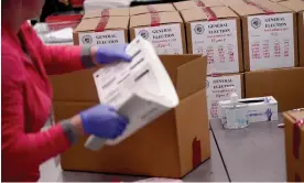  ?? ?? An election worker boxes tabulated ballots in Phoenix, Arizona. Photograph: Matt York/