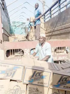  ?? ?? A labourer at Singer Market