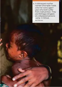  ?? Rex Features ?? A distressed mother named Shamijder holds onto her twins aged 1 year who both suffer from malnutriti­on. They are Rohingya refugees at a displaced persons camp in Sittwe.