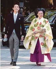  ?? [ FOTO EPA ] ?? Ayako dan pasanganny­a, Moriya.