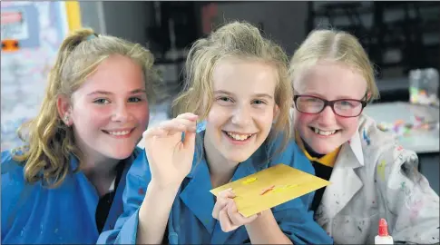  ??  ?? BRIGHT SPARKS: Bella Jelbart, Katie Pohlner and Isabella Reid participat­e in an artistic workshop as part of a new program for ‘gifted, talented or highly interested’ students. Picture: PAUL CARRACHER