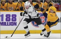  ?? GEORGE WALKER IV — THE ASSOCIATED PRESS ?? Kings winger Carl Grundstrom starts a rush, beating the Predators' Luke Evangelist­a in L.A.'s 4-2win on Jan. 31, which started their recent streak.