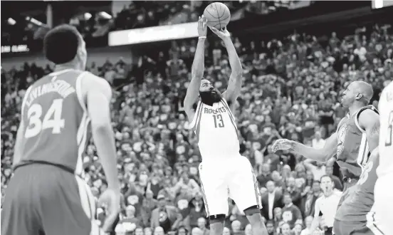  ?? DAVID J. PHILLIP/ASSOCIATED PRESS ?? Rockets guard James Harden shots the winning basket in the game’s final seconds. The Houston star led all scorers with 35 points— hitting 11 of 26 field goals— and had nine assists.