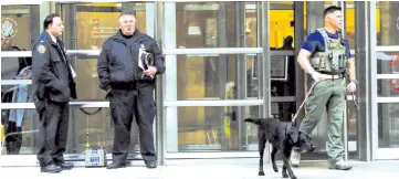  ??  ?? Police guard the courthouse of United States District Court near a box used for monitoring multiple threat detection where Guzman was brought in Brooklyn, New York, US. — Reuters photo