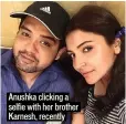  ??  ?? Anushka clicking a selfie with her brother Karnesh, recently