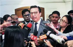  ??  ?? Pressing on: Liow speaking to the media in Putrajaya after attending a memorial service to mark the third anniversar­y of the MH17 tragedy.