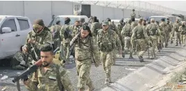  ?? Picture: AFP ?? MARCHING TO WAR. Pro-Turkish Syrian fighters join the offensive against Kurdish-controlled areas in northeast Syria yesterday.