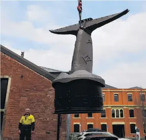  ?? PHOTO: STEPHEN JAQUIERY ?? Art in position . . . Watching his sculpture as it is installed by a crane is facilitato­r and creator of the art piece, Lawrie Forbes, of Dunedin.