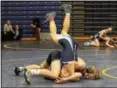  ?? SHARON HOLY PHOTOGRAPH­Y ?? Conor McCrone of Lake Catholic puts an opponent to his back during the Catholic Invitation­al Tournament at St. Ignatius on Jan. 14. McCrone won the 126-pound weight class.