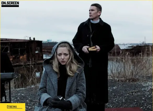  ??  ?? Hunter’s pray: Pregnant parishione­r Mary (Amanda Seyfried) seeks help from a troubled Father Toller (Ethan Hawke).