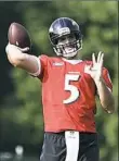  ?? Gail Burton/Associated Press ?? Baltimore Ravens quarterbac­k Joe Flacco throws a pass during practice Thursday in Owings Mills, Md.