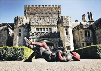  ??  ?? Ryan Reynolds posted this photo of himself as Deadpool in front of Hatley Castle on Saturday with the caption: “Dropped by X-Mansion. Looked closely for Beast’s lawn bombs before taking well deserved nap.”