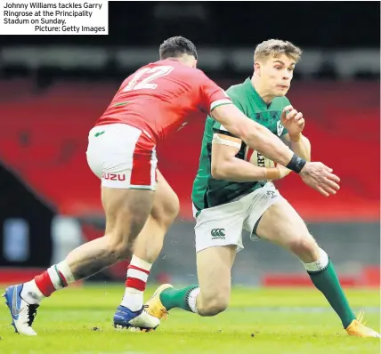  ??  ?? Johnny Williams tackles Garry Ringrose at the Principali­ty Stadum on Sunday.
Picture: Getty Images