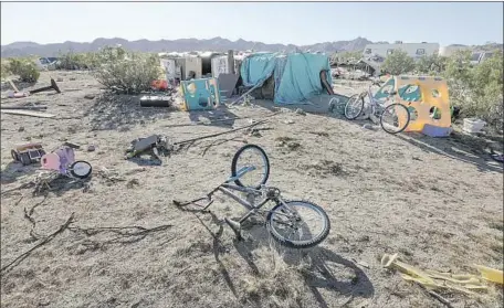  ?? Irfan Khan Los Angeles Times ?? BIKES lie on the property where Daniel Panico and Mona Kirk and their three children were found in a plywood shelter this week.