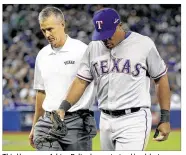  ?? TOM SZCZERBOWS­KI / GETTY IMAGES ?? Third baseman Adrian Beltre has a strained back but no structural damage, according to the Rangers. His status for Game 2 is uncertain.