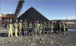  ?? STEPHANIE mACDOUgALL PHOTO ?? Cape Breton’s newest generation of coal miners stand outside the first coal to come out of the Donkin Mine on Tuesday.