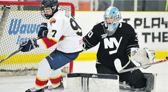  ?? DAN HICKLING/HICKLING IMAGES ?? John Ulicny of the Sun County Panthers tries to control the puck in front of Elite Hockey Group goaltender Liam O’Gwen Wednesday. The Panthers fell 5-2.