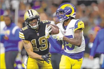  ?? Tyler Kaufman Associated Press ?? SECOND-YEAR Rams wide receiver Tutu Atwell beats Saints safety Chris Harris Jr. in the first quarter to make a 62-yard catch for the first touchdown of his career. The reception was just his second in the NFL.