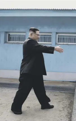  ??  ?? Kim Jong-un walks to meet Moon Jae-in at the border as South Korean Buddhists hold a service praying for a successful summit and onlookers cheer as talks begin