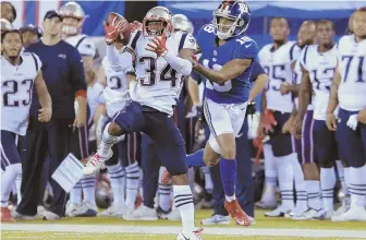  ?? AP PHOTO ?? PICKING UP HIS TEAM: J.C. Jackson intercepts a pass intended for the Giants’ Roger Lewis during the Patriots’ 17-12 preseason victory Thursday night.