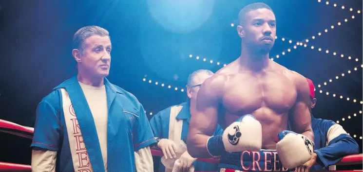  ?? BARRY WETCHER / METRO GOLDWYN MAYER PICTURES / WARNER BROS. PICTURES ?? Sylvester Stallone stars as Rocky Balboa and Michael B. Jordan as Adonis Creed in Creed II, which pits Jordan’s character against the son of Rocky IV nemesis Ivan Drago.